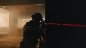 tactical soldier with night vision in dark room